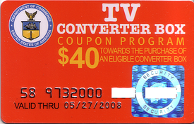 Converter box coupon voucher. A hard plastic card in red that reads 'TV CONVERTER BOX COUPON PROGRAM - $40 TOWARDS THE PURCHASE OF AN ELIGABLE CONVERTER BOX