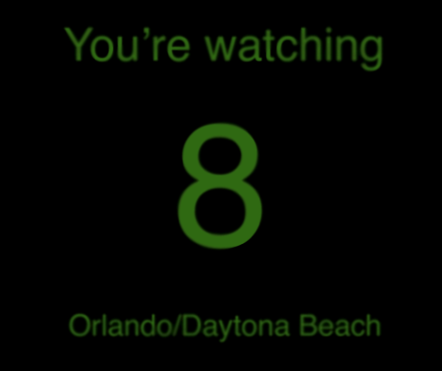 ID: Recreation of the station ID that I saw. Black background with green text saying 'You're watching', followed by a very large number eight in the middle. Below it reads 'Orlando/Daytona Beach'.